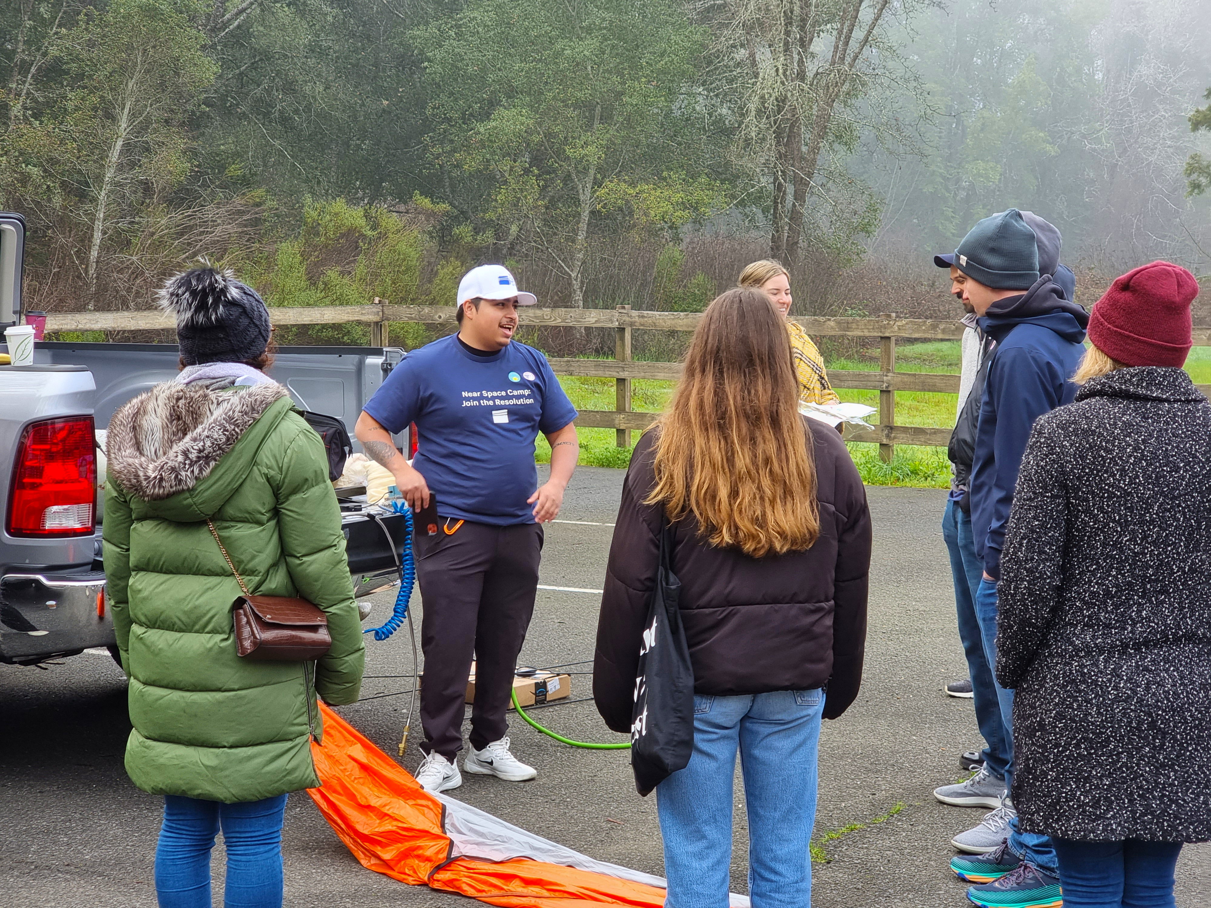 Michael Robles explaining our launch procedures to Near Space Labs team members during our company-wide off site.