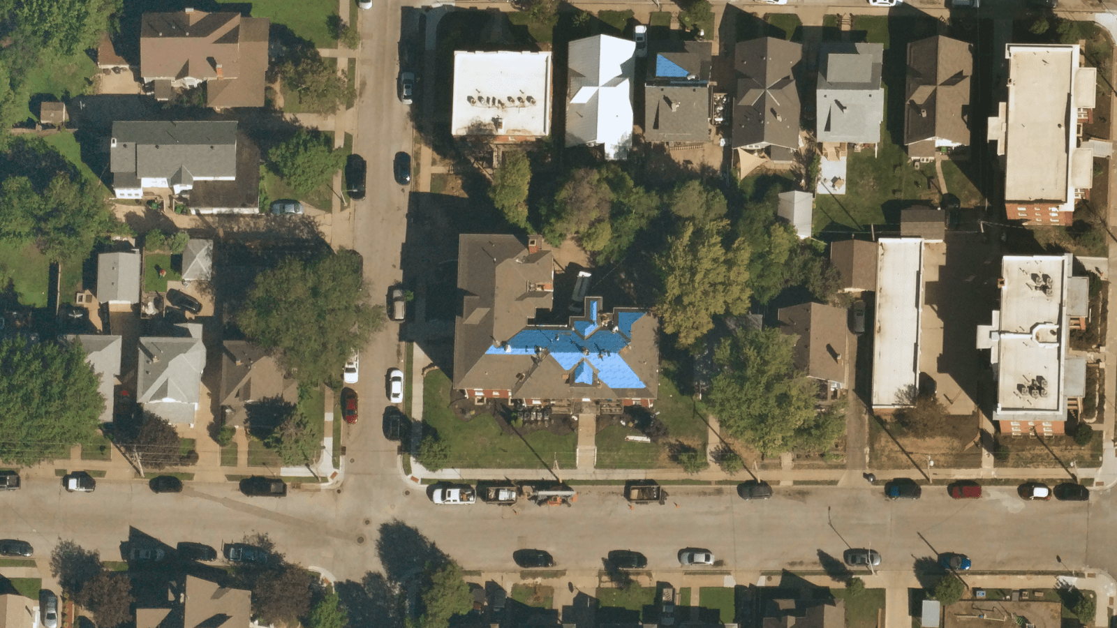 Near Space Labs' 10 cm capture of property that shows blue tarp on roof indication roof damage.