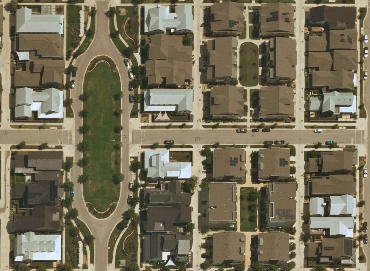 Near Space Labs' image of a neighborhood showing houses with different types of roofing material.