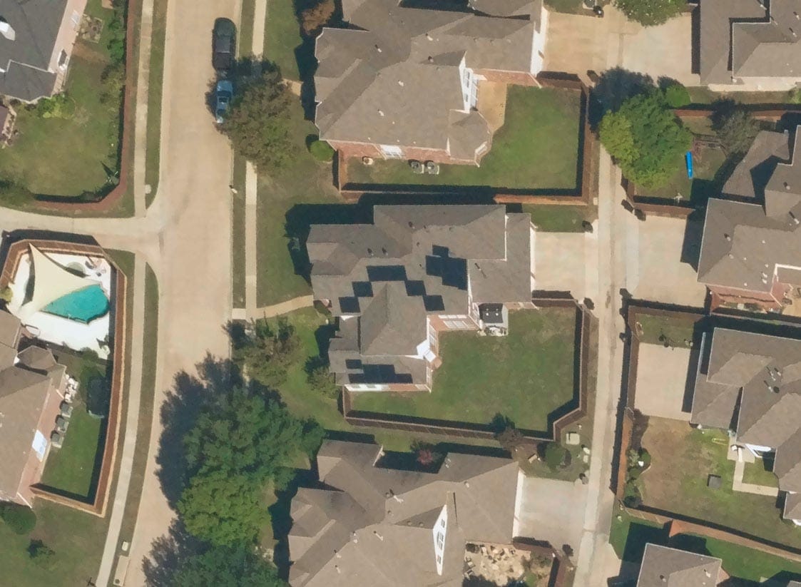 Near Space Labs' image of the same property with the addition of solar panels to the roof.